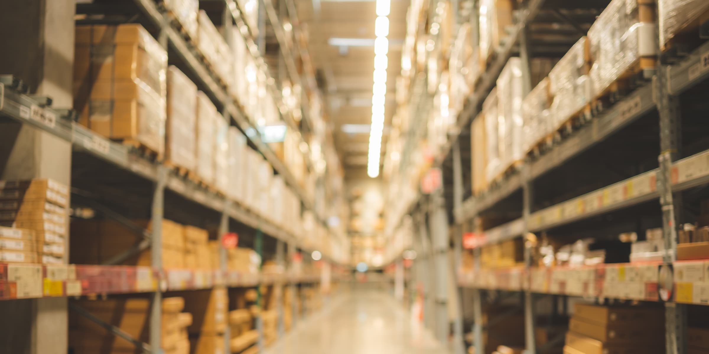 Warehouse interior with racking and loading aisles